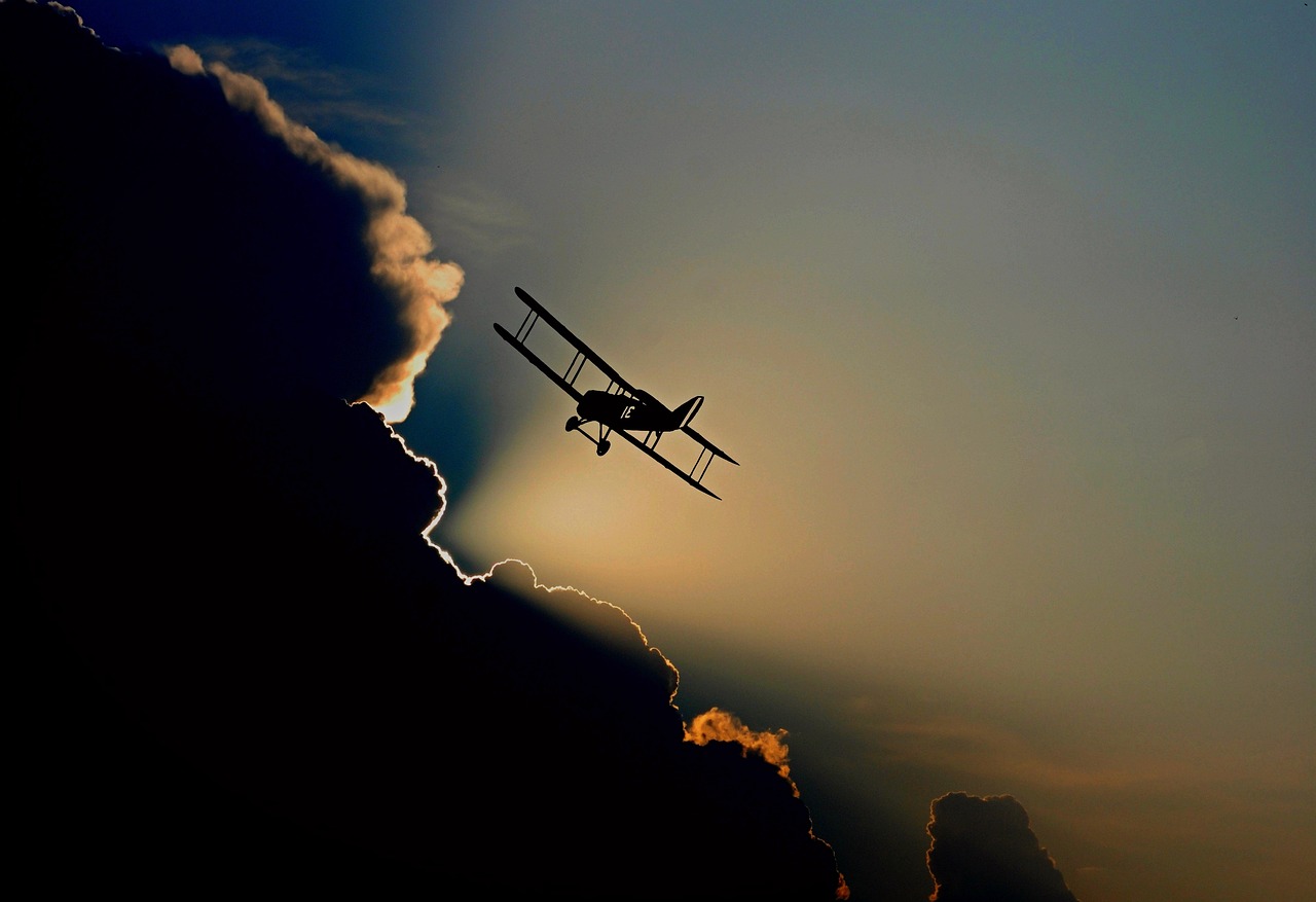 aircraft, double decker, biplane, flight, silhouettes, clouds, sky, plane, airplane, small plane, flying plane, propeller plane, nature, flying, aviation, weather, storm, cumulus, dark clouds, atmosphere, cumulus clouds, sunbeam, backlighting